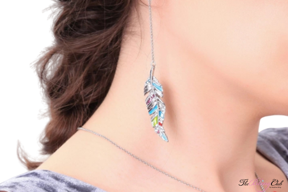 the bling club enamel feather drop chain earring on model